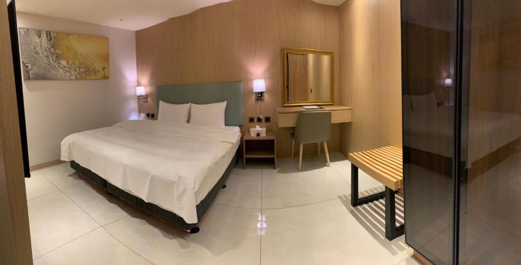 Postel nebo postele na pokoji v ubytování Michi Hotel - Luodong