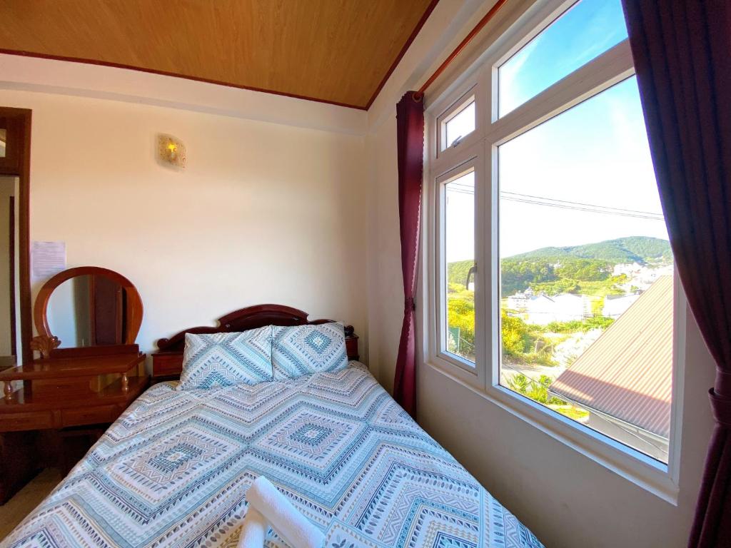 Letto o letti in una camera di Villa Tường Vy - Đà Lạt