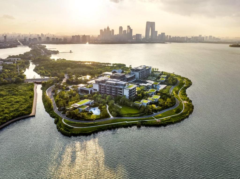 an aerial view of a resort on a island in the water at Four Seasons Hotel Suzhou in Suzhou