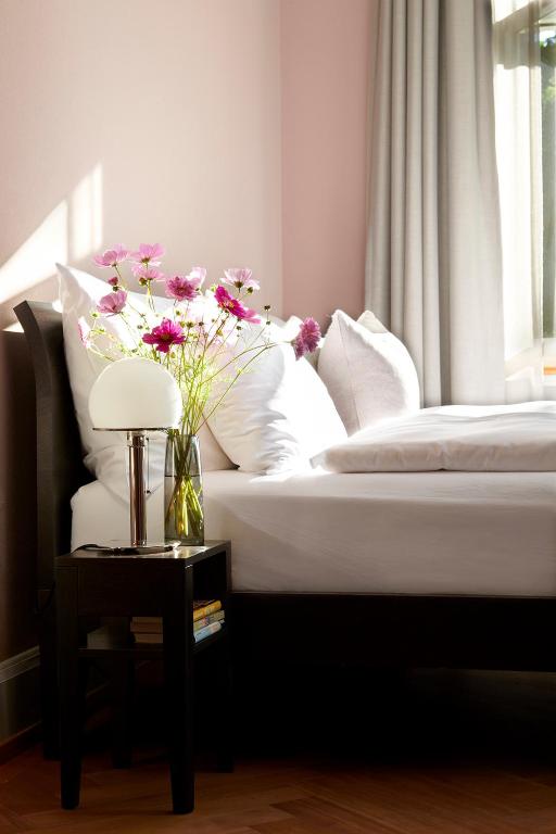 Letto o letti in una camera di Signau House & Garden Boutique Hotel Zürich