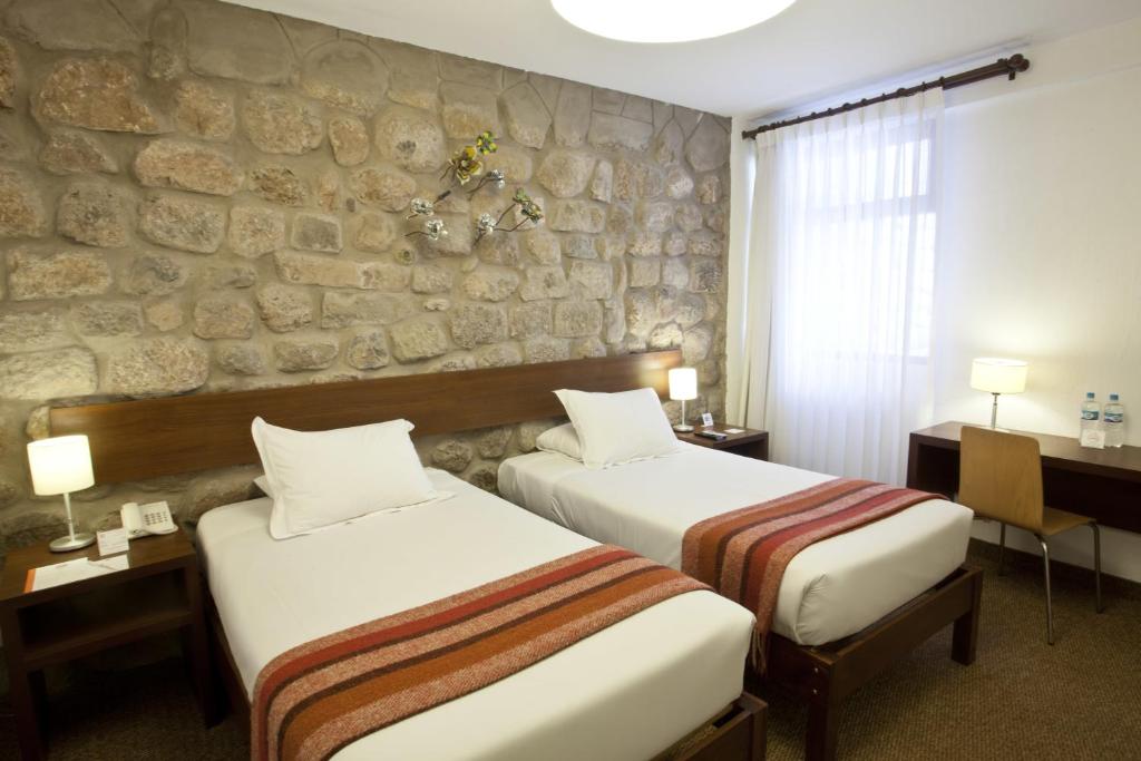 Postel nebo postele na pokoji v ubytování Tierra Viva Cusco Saphi Hotel