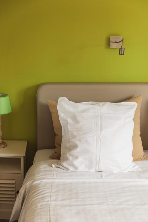 Postel nebo postele na pokoji v ubytování Guesthouse Amfora