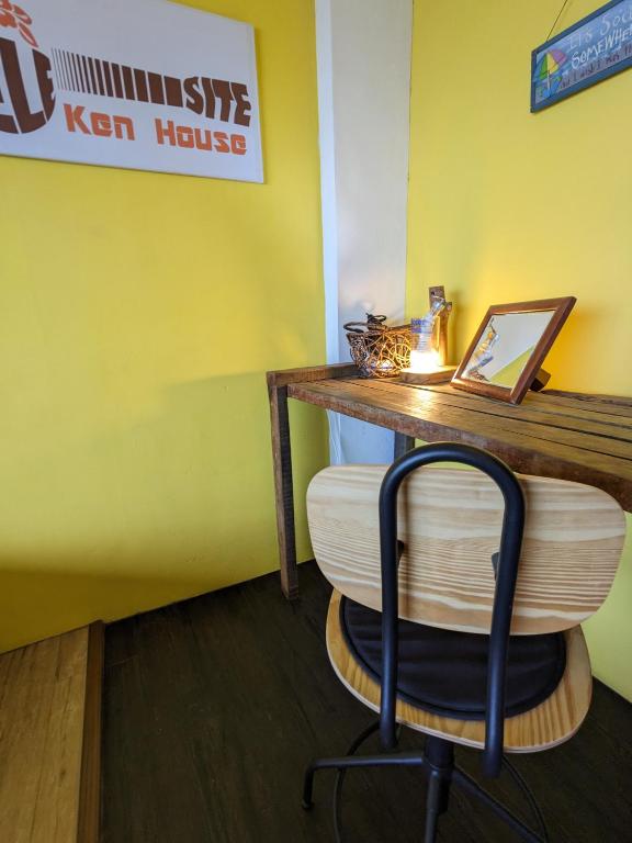 a chair sitting at a desk in a restaurant at Blackport Seaview Homestay in Yanliau