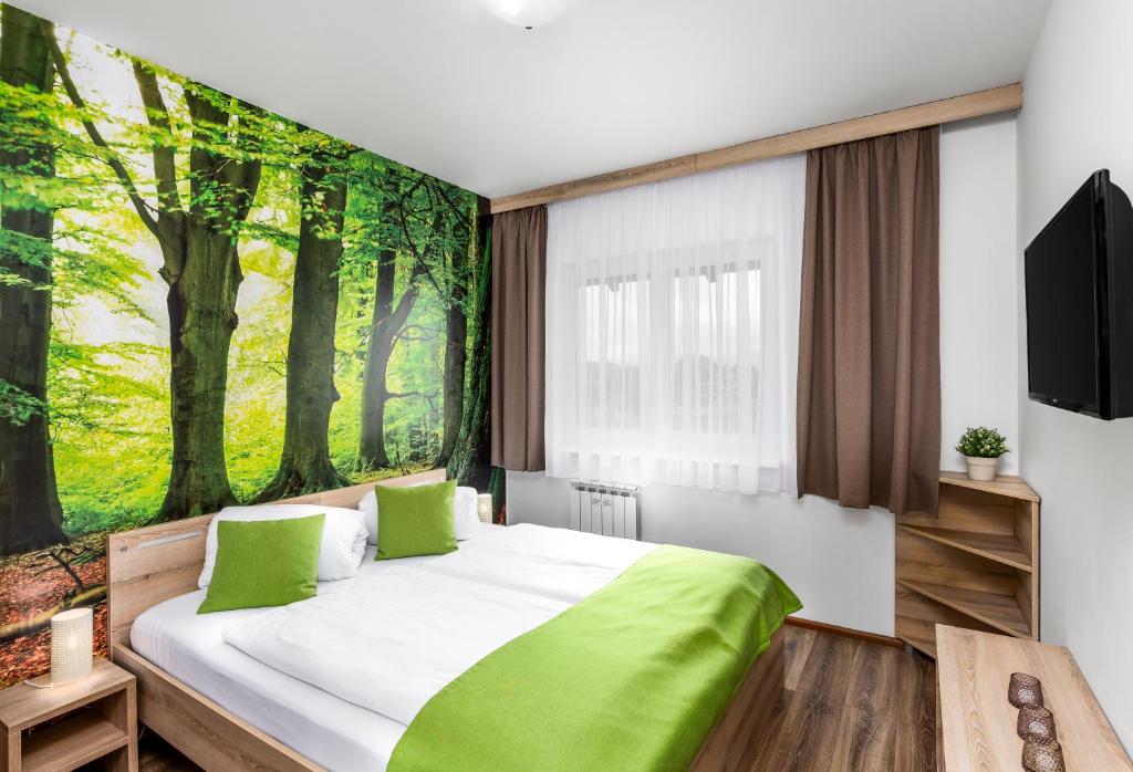 Postel nebo postele na pokoji v ubytování Hilson Jasna - Garden resort