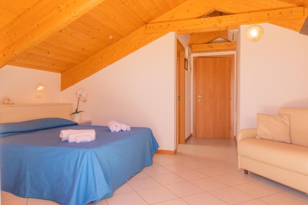 Postel nebo postele na pokoji v ubytování Hotel Merano