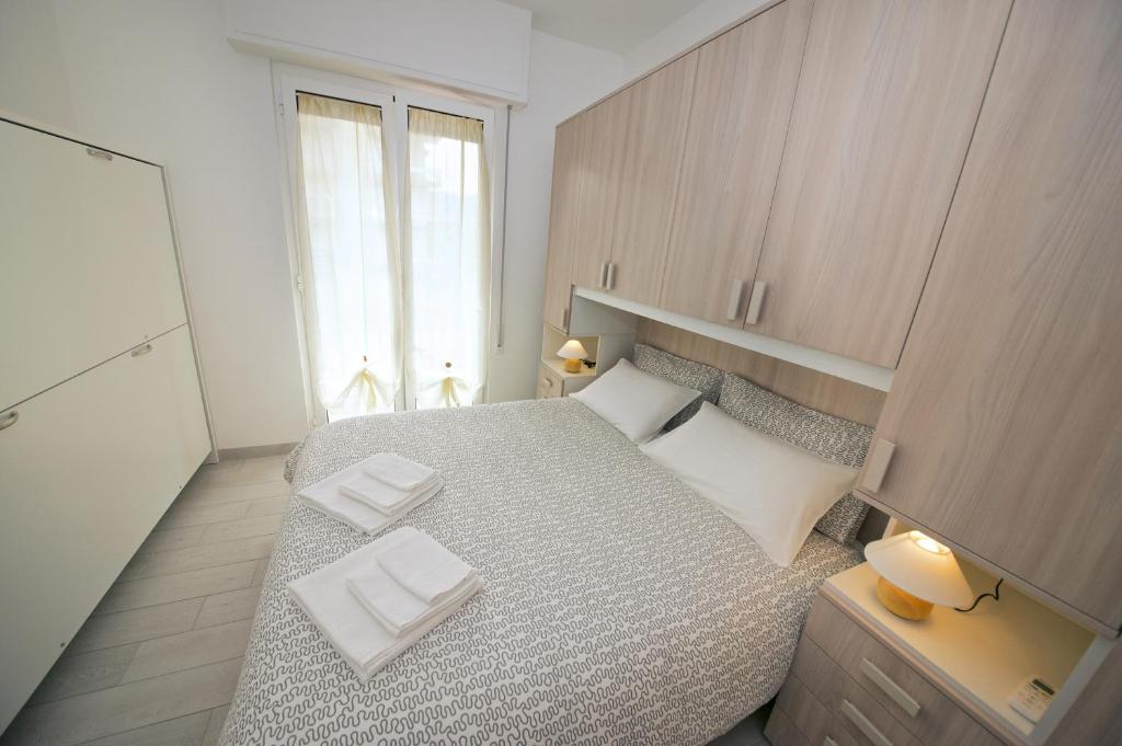 Posteľ alebo postele v izbe v ubytovaní Fornaci 9 RivieraHoliday