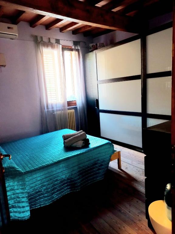 Łóżko lub łóżka w pokoju w obiekcie Casa Gelsomino