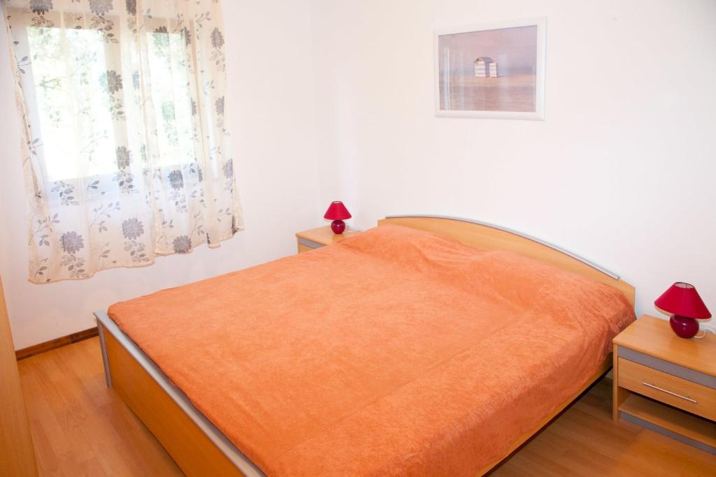 Postel nebo postele na pokoji v ubytování Kucica Lusi