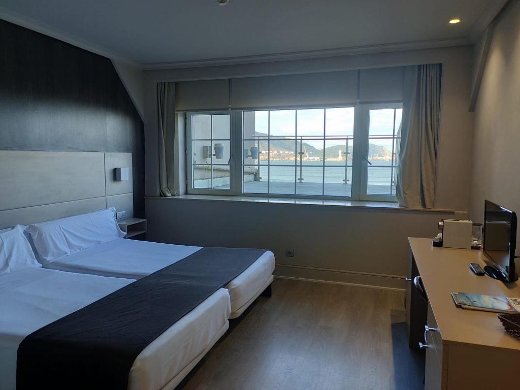 Postel nebo postele na pokoji v ubytování Hotel Igeretxe