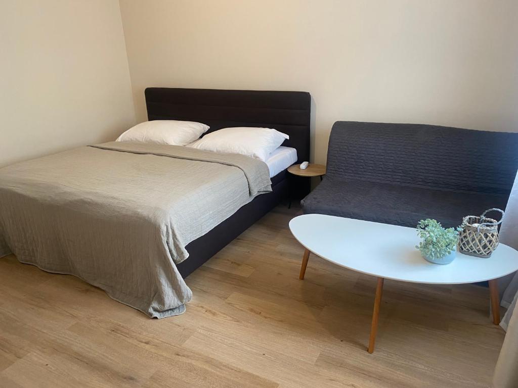 Postel nebo postele na pokoji v ubytování STING Apartments Havířov