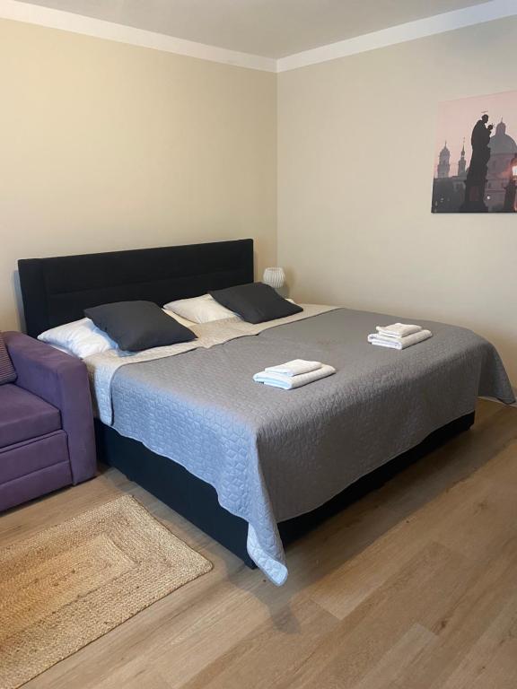 Postel nebo postele na pokoji v ubytování STING Apartments Havířov