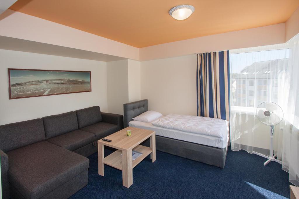 Lova arba lovos apgyvendinimo įstaigoje Tauras Center Hotel
