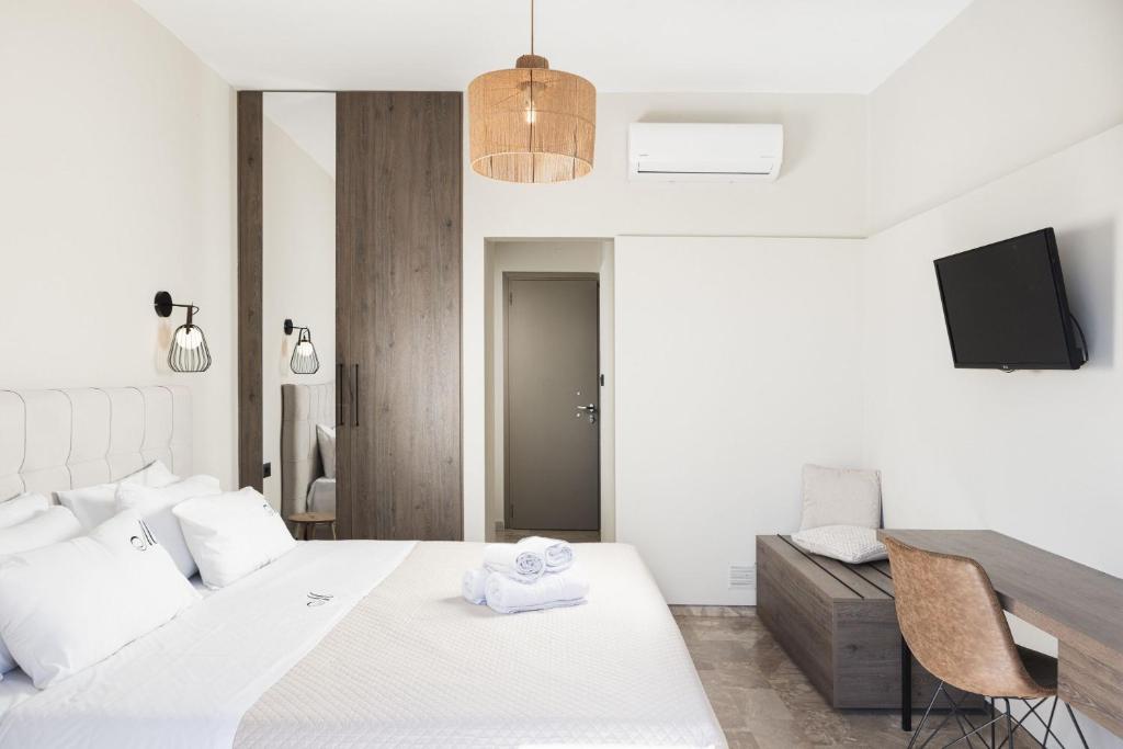 Postel nebo postele na pokoji v ubytování Manthos Beachfront Apartments