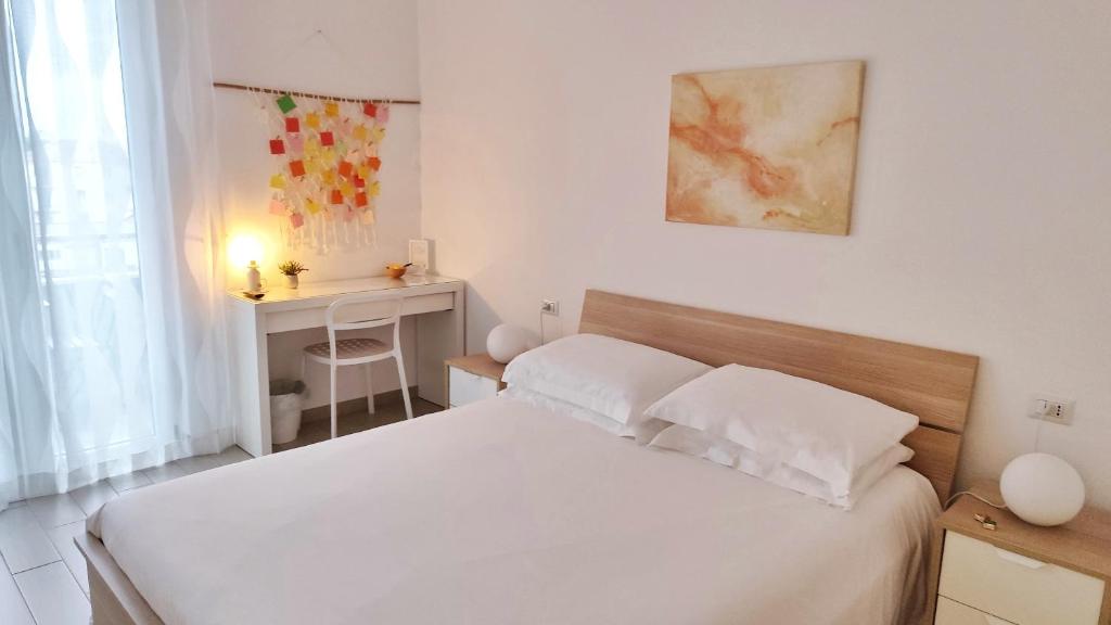 Postel nebo postele na pokoji v ubytování B&B Le Albarelle