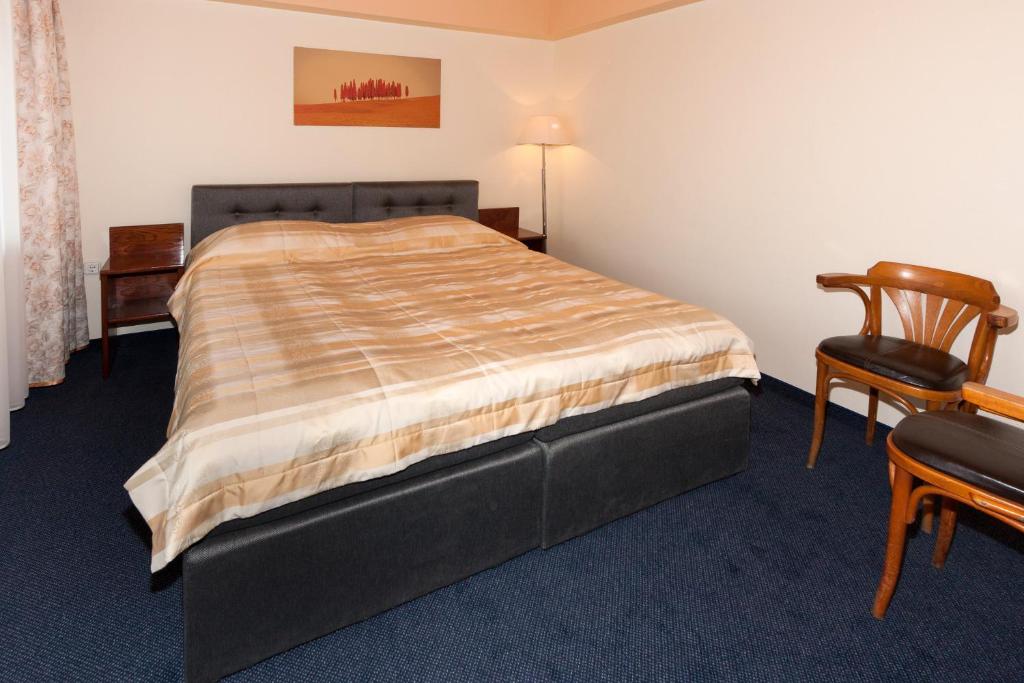Lova arba lovos apgyvendinimo įstaigoje Tauras Center Hotel