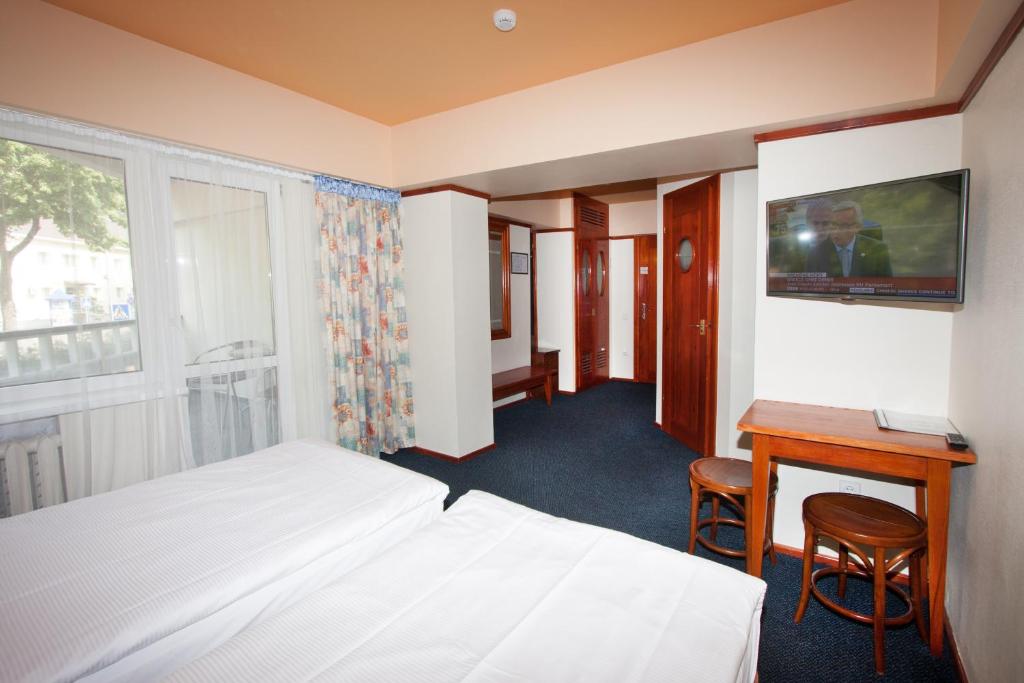 Lova arba lovos apgyvendinimo įstaigoje Tauras Center Hotel