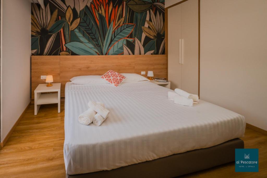 Postel nebo postele na pokoji v ubytování Al Pescatore Suites