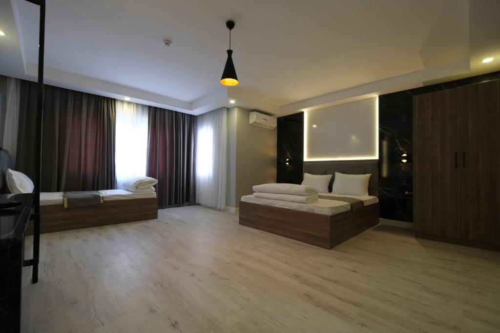 a living room with a couch and a bed at Cevvo Hotel in Istanbul