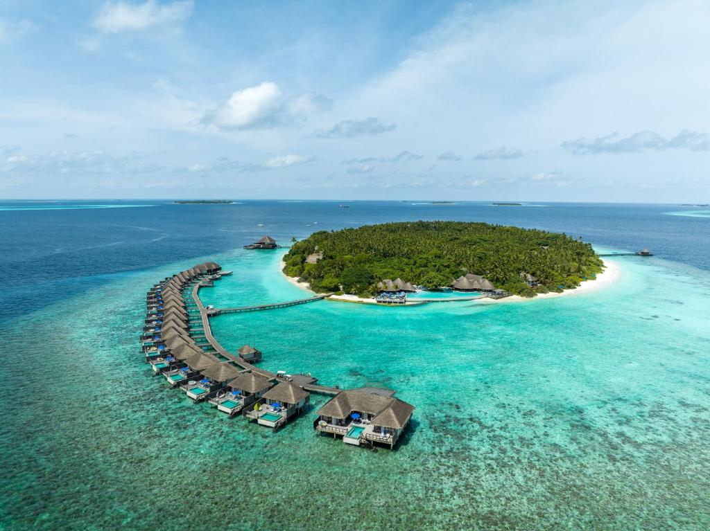 an island in the ocean with a resort at Dusit Thani Maldives in Baa Atoll