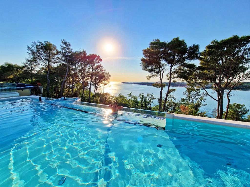 The swimming pool at or close to Punto Blu Village in Lanterna Premium Camping Resort