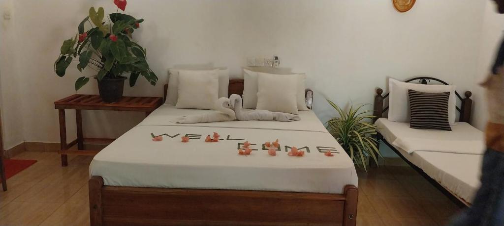 Postel nebo postele na pokoji v ubytování Hotel Samanala Sigiriya