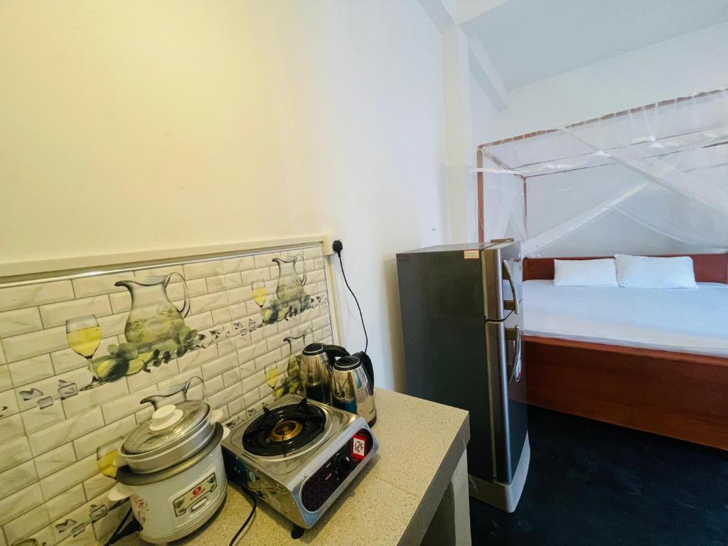 Postel nebo postele na pokoji v ubytování Villa Don Williams Weligama