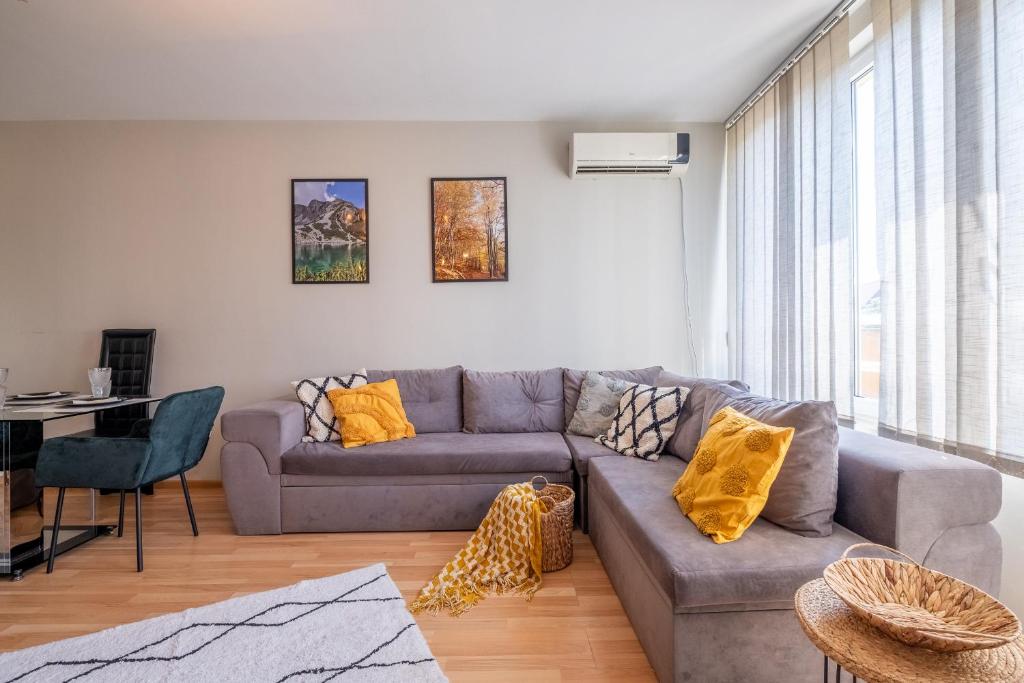 a living room with a couch and a table at Deja vu, Cozy & Quiet 1 BDR Apt Free Parking Fast Wi-Fi in Sofia