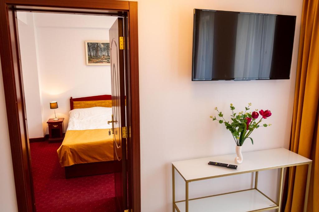 Postel nebo postele na pokoji v ubytování Hotel Cantemir