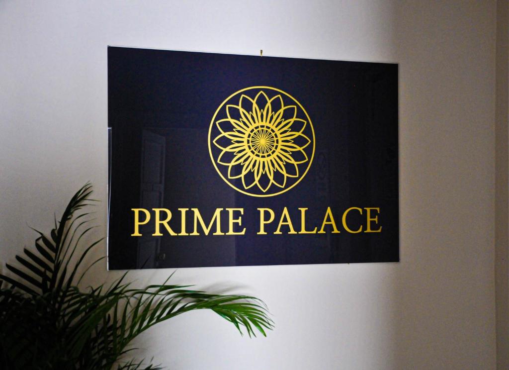 a picture of a prime palace sign on a wall at Guest House Prime Palace in Rome