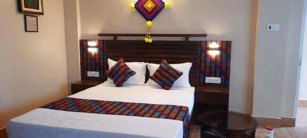 Ένα ή περισσότερα κρεβάτια σε δωμάτιο στο JJ Tribal Inn