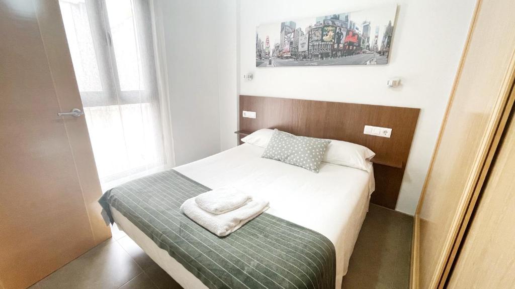 Postel nebo postele na pokoji v ubytování Apartamentos Los Flamencos