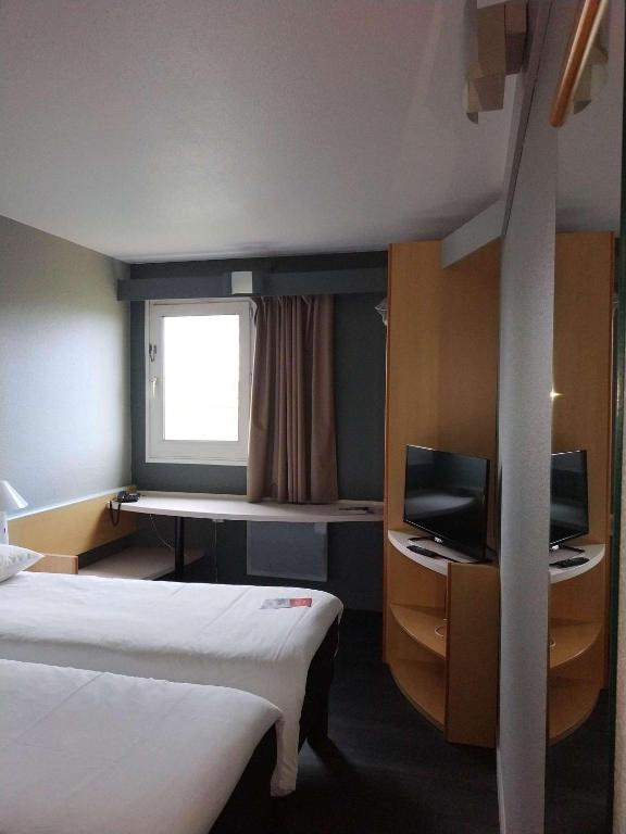 Postel nebo postele na pokoji v ubytování ibis Auxerre Sud