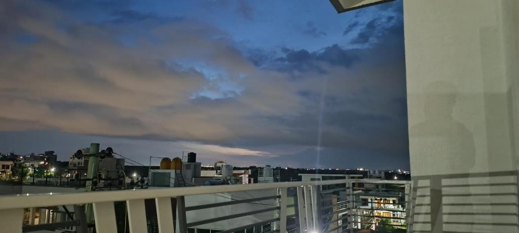 a view of a city skyline at night at The Heritage Serviced Apartments in Mandya