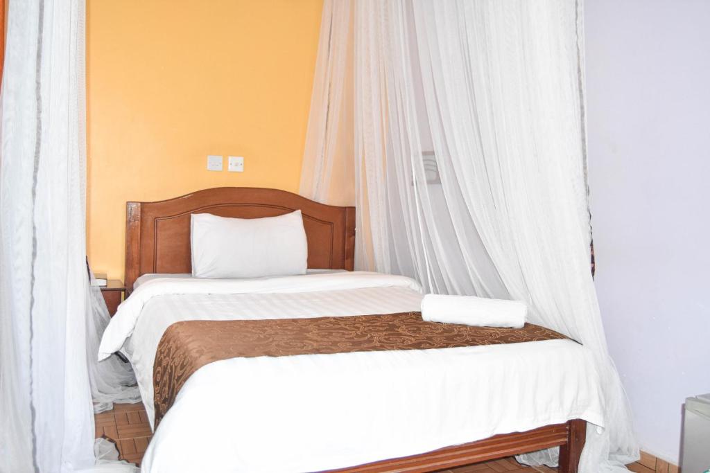Postel nebo postele na pokoji v ubytování Sunstar Hotel Nairobi