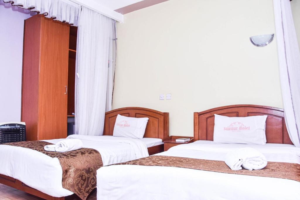 Postel nebo postele na pokoji v ubytování Sunstar Hotel Nairobi