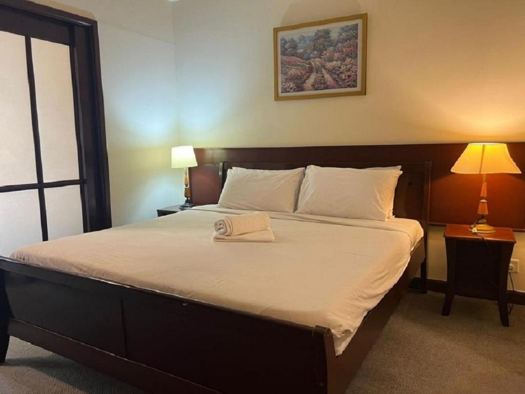 Postel nebo postele na pokoji v ubytování RESORT SUITES AT BARJAYA TIMES SQUARE kL