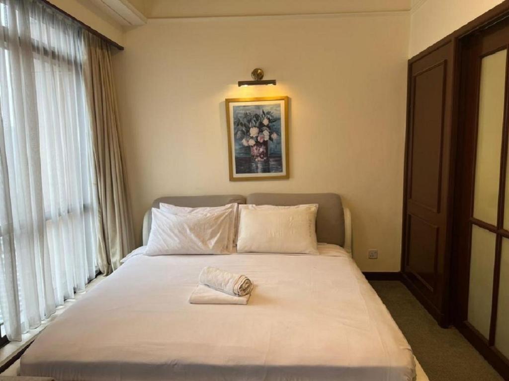 Postel nebo postele na pokoji v ubytování RESORT SUITES AT BARJAYA TIMES SQUARE kL