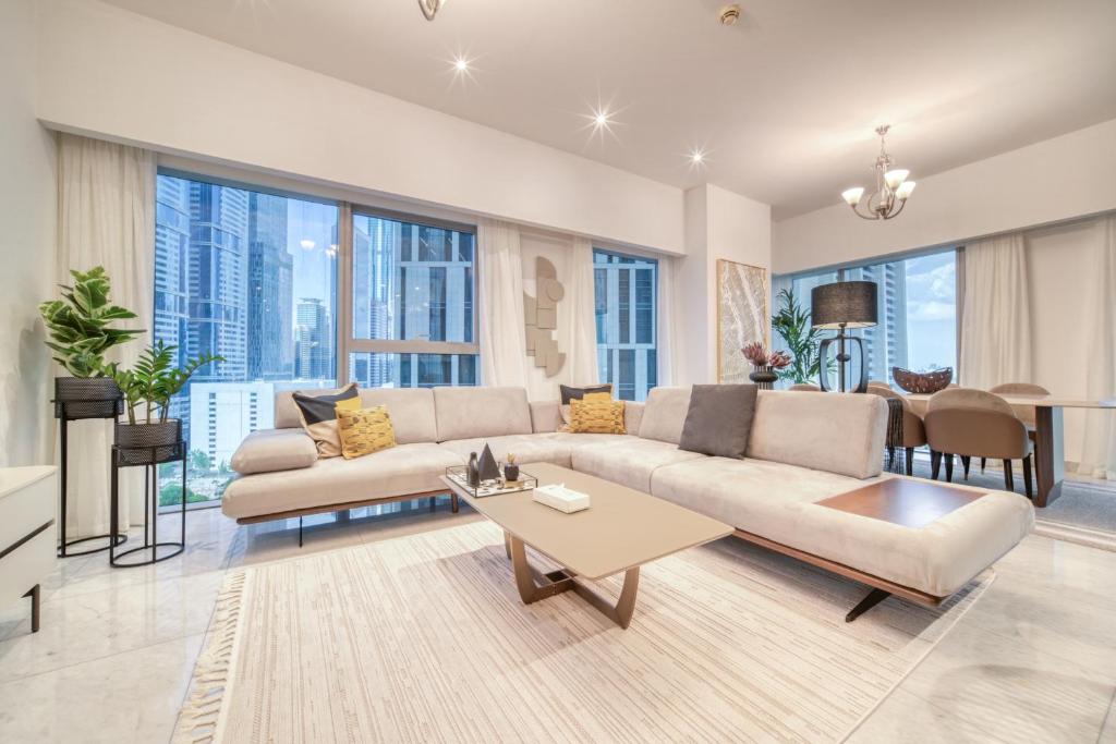a living room with a couch and a table at Central Park Towers, City View - DIFC - Mint Stay in Dubai