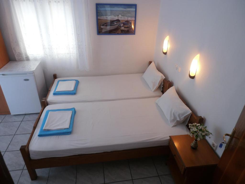 Postel nebo postele na pokoji v ubytování Rooms Ntontas