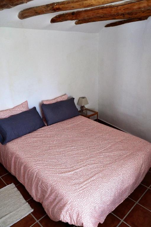 Postel nebo postele na pokoji v ubytování Casa del Arrabal
