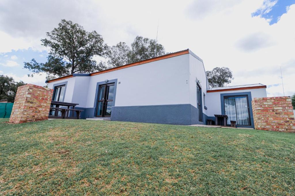 a house with a lawn in front of it at Emerald Resort & Casino in Vanderbijlpark
