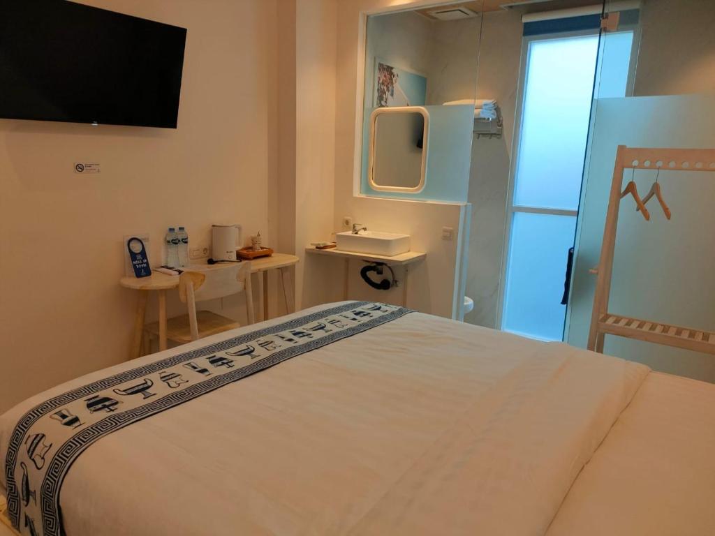 Postel nebo postele na pokoji v ubytování Little Mykonos