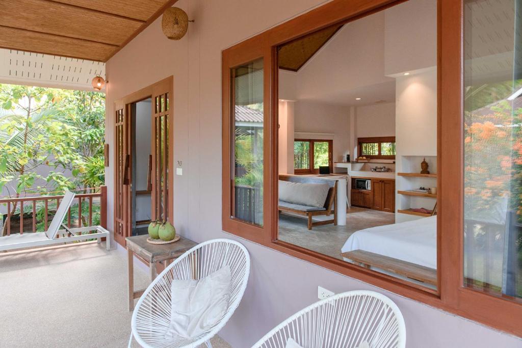 Postel nebo postele na pokoji v ubytování Boonya Swiss Home