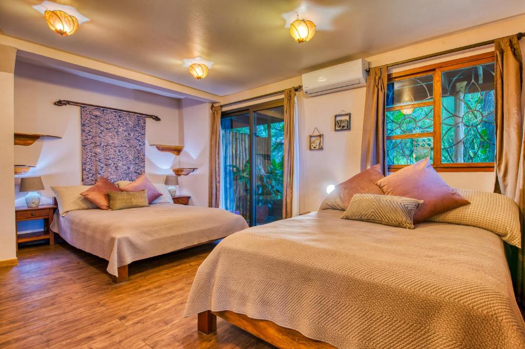Postel nebo postele na pokoji v ubytování Hotel Amor de Mar