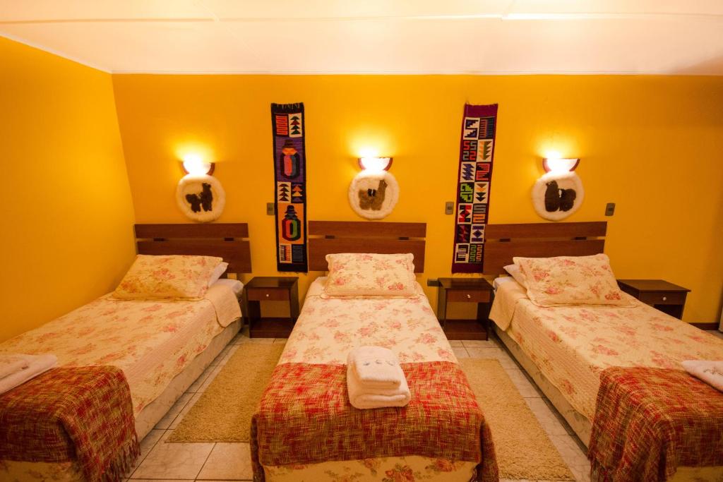 Postel nebo postele na pokoji v ubytování Hostal Kirckir