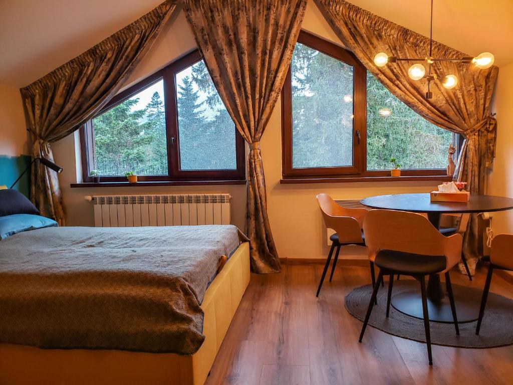 A bed or beds in a room at Borovets Forest view (A56)