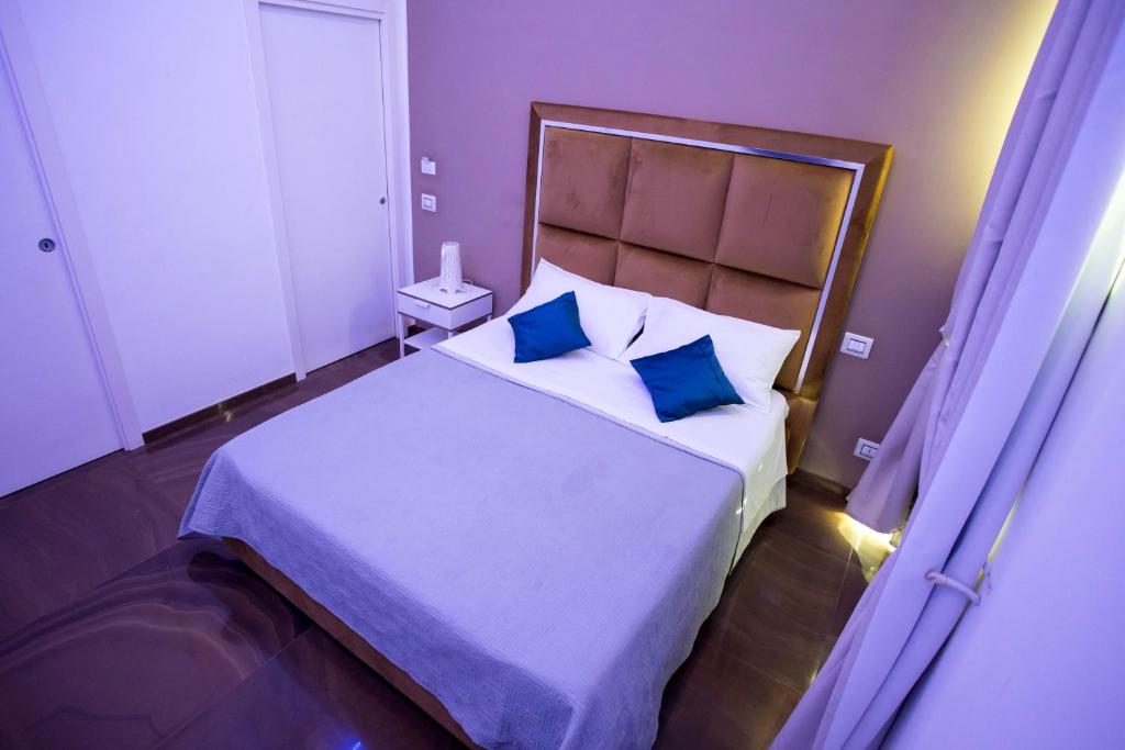 Postel nebo postele na pokoji v ubytování Palazzo 15 Napoli