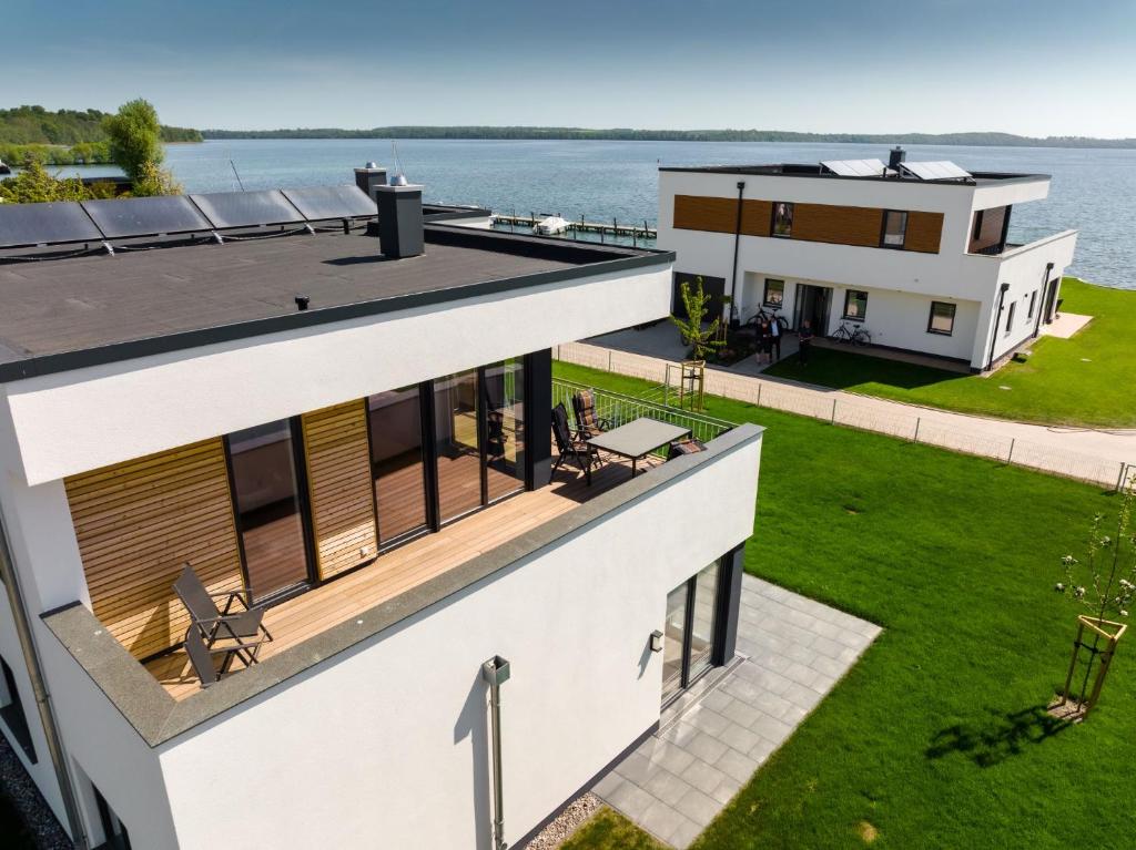 an aerial view of a house with a view of the water at Hangar19 in Schwerin