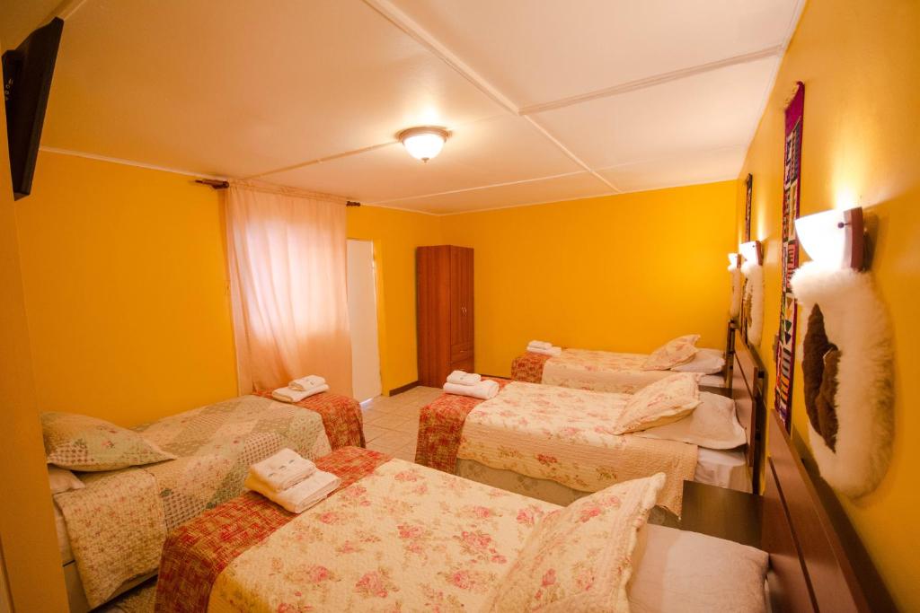 Postel nebo postele na pokoji v ubytování Hostal Kirckir