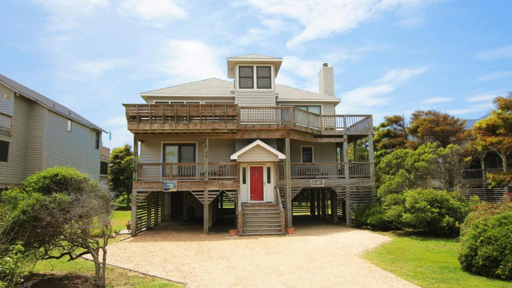 a large house with a deck with a red door at Semi-Oceanfront, Close to Beach, Dogs Welcome, SA8, Berry in Sanderling